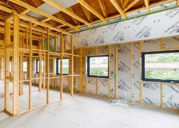 Construction of a house from insulated timber