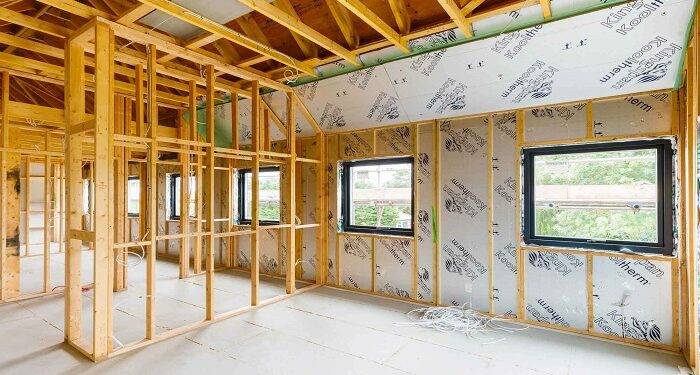 Construction of a house from insulated timber